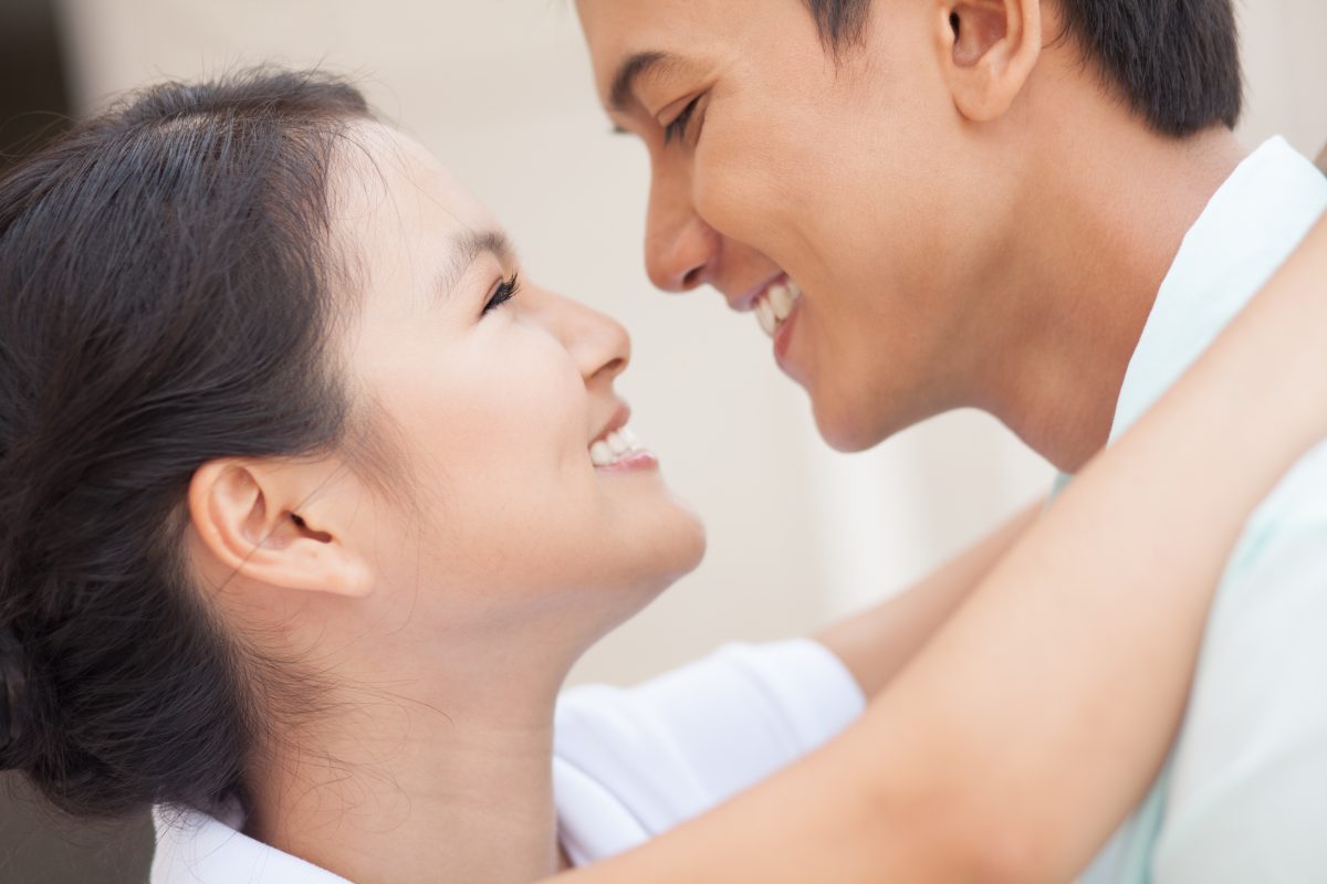 Two Young People Looking At Each Other With Love